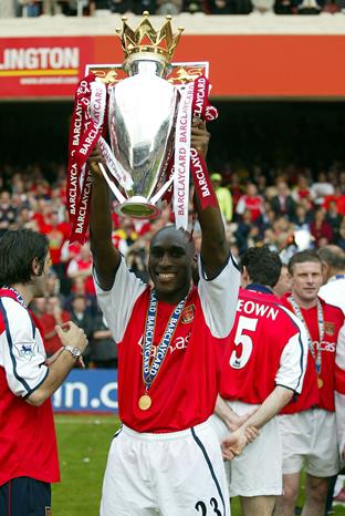 Sol Campbell lifting the Premier League Trophy for Arsenal in 2002